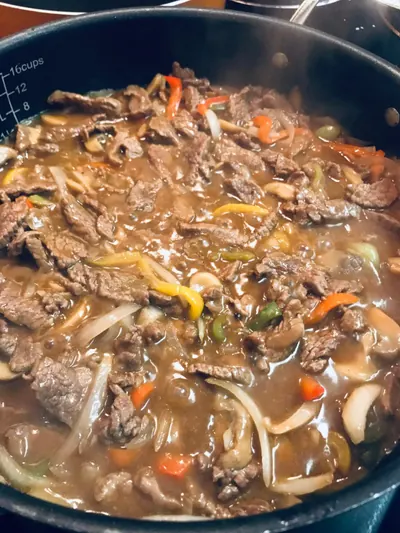 Braised beef with mushrooms and vegetables, ready to portion